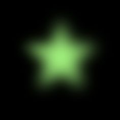 a blurry image of a green star in the dark