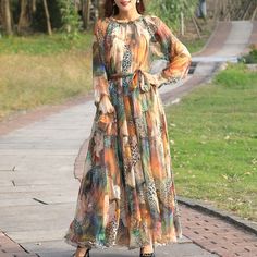 Discover effortless style and comfort with our Floral Printed Loose Chiffon Maxi Dress. This dress is the embodiment of laid-back elegance, perfect for embracing a casual yet chic look. The Casual style of this dress ensures you exude comfort and ease, making it an ideal choice for a variety of occasions. Crafted from high-quality Polyester, this dress promises both durability and a lightweight feel against your skin. As an Item Type: Dresses, this piece becomes a versatile addition to your ward Long Sleeve Chiffon Dress For Casual Wear, Long Sleeve Chiffon Dress For Casual Occasions, Bohemian Long Sleeve Flowy Chiffon Dress, Long Sleeve Chiffon Beach Dress, Flowy Long Sleeve Bohemian Chiffon Dress, Casual Long Sleeve Chiffon Dress, Flowy Long Sleeve Chiffon Dress For Casual Wear, Bohemian Chiffon Dress For Fall, Bohemian Multicolor Long Sleeve Chiffon Dress