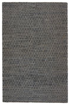 a gray rug with diamond shapes on it