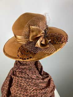 This butterscotch/camel/caramel widebrim hat is flat out fabulous! It is hand blocked over a vintage hat block and hand sewn with many tiny stitches. The crown (top) of the hat comes to a soft point and the brim has a slight down turn. Millinery wire is sewn inside of the brim edge to help the hat keep it's shape. The band and brim edge is a gorgeous hand dyed silk ribbon. It's finished with a three loop now, two pretty beaded sequin flowers, coordinating feathers and a large bow of vintage nett Vintage Top Hat With Short Brim For Fall, Vintage Fur Felt Fedora For Fall, Vintage Fedora Top Hat For Fall, Vintage Short Brim Top Hat For Fall, Vintage Fedora With Curved Brim For Fall, Vintage Brimmed Fedora For Fall, Vintage Wide Brim Fur Felt Fedora, Vintage Fitted Fedora For Fall, Brown Fitted Fedora For Kentucky Derby