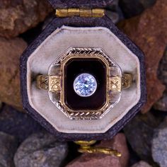 This lovely vintage ring displays an onyx tab with a bezel set lab created spinel set in the center. The ring is crafted in 10k two tone gold and shows a soft patina. Its current size is a 6. Vintage White Gold Signet Ring With Center Stone, Vintage Round Birthstone Ring For Formal Occasions, Art Deco Gold Enamel Anniversary Ring, Vintage Yellow Gold Enamel Ring With Rose Cut Diamonds, Vintage Yellow Gold Signet Ring With Center Stone, Vintage Gold Enamel Ring With Rose Cut Diamonds, Antique Yellow Gold Diamond Ring With Bezel Setting, Vintage Round Gemstone Signet Ring, 14k Gold Art Deco Ring With Center Stone