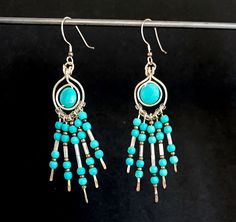 Wire Turquoise Earrings in Native American Style - 10mm Turquoise Magnesite Discs, 3mm Beads with Silver Accents   PACKAGING:   Your purchase will be sent in a complimentary gift box, ready for gifting if your purchasing for someone else! If you are purchasing this item as a gift I can an add a little message and send it on your behalf. Just leave mailing address instructions at checkout. DELIVERY TIME: Domestic orders arrive within 2-8 business days. International shipments average 7-14 days, depending on customs in your country shipments could take longer. I ship via USPS First Class and delivery confirmation is included for domestic orders. Please feel free to convo me with any questions or special orders. I would love to make a piece for you! See more pendants and jewelry here: https:/ Turquoise Beaded Earrings With Ear Wire, Gift Turquoise Earrings With Polished Beads, Turquoise Round Beaded Earrings With Ear Wire, Turquoise Dangle Earrings With Polished Beads, Bohemian Polished Beads Turquoise Earrings, Turquoise Wire Wrapped Beaded Earrings As Gift, Native American Fashion, Silver Accents, Turquoise Earrings