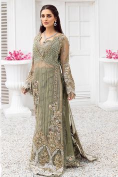 Discover elegance in our Sage Green Organza Long Shirt paired with a Raw Silk Lehenga, perfect for Nikah ceremonies. Explore Pakistani Nikah dresses and bridal wear for traditional Nikah attire, blending style with cultural significance.Immerse yourself in a luxurious blend of avant-garde design, ethereal embellishments, and exquisite craftsmanship with our latest creation, a stunning ensemble that promises to elevate your Nikah ceremony attire to new heights of elegance and sophistication. Craf Nikah Attire, Nikah Dresses, Day Wedding Outfit, Nikah Dress, Raw Silk Lehenga, Embroidery Motif, Pakistani Fancy Dresses, Silk Lehenga, Stylish Dress Designs