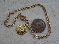 Religious French vermeil gold plated catholic bracelet with medal pendant charm of Saint Therese of Lisieux. Length of the bracelet 7,8 inches ( 19,3 cm ) Measure of the medal 0,52 x 0,65 inches ( 1,33 x 1,66 cm ) I bought the bracelet on a brocante ( fleamarket ) in France. If you donn't have paypal, you can pay by bank transfer. I deliver all over the world. Registered shipping is possible. If you have a question feel free to ask. Please take a look at my other items for sale. Vintage Gold Rosary Bracelet Gift, Vintage Gold Rosary Bracelet As A Gift, Vintage Gold Rosary Bracelet For Gift, Gold Spiritual Rosary Bracelet With Charms, Spiritual Gold Rosary Bracelet With Charms, Catholic Bracelet, Saint Therese, St Therese Of Lisieux, Thérèse Of Lisieux