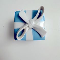 a blue and white plate with a pair of scissors on it