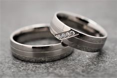 two wedding rings with diamonds on them