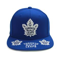 Add some old school swagger to your closet with the Toronto Maple Leafs vintage hat trick snapback hat by Mitchell & Ness. 100% polyester wool feel crown, raised embroidered graphics at front and on visor, brand logo embroidered at back, green undervisor with adjustable snapback closure, officially licensed NHL product. Style: 6HSSSH22089TMLB Throwback Blue Baseball Season Hats, Throwback Blue Hat With Curved Brim, Blue Throwback Hat With Curved Brim, Blue Throwback Snapback Baseball Cap, Fan Gear Hats With Flat Bill, Throwback Adjustable Hat With Curved Brim, Adjustable Snapback Hats For Fan Gear, Adjustable Throwback Hat With Curved Brim, Adjustable Snapback Fan Gear Hats