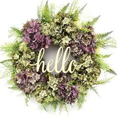 a wreath with the word hello written on it and an image of a red cross in the background