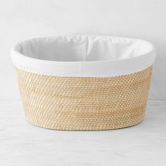 an empty basket with white lining on the bottom