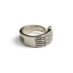 From our tribal collection, Hand made by Hill tribe artist from the Golden Triangle. A remarkable open band ring, hand carved oxidised silver with etched tribal motifs and a spiral tip. Adjustable in size and suitable for both, man and woman. Material: Silver Sizes : US 7 / 8 / 9 This handcrafted piece is 95% to 99% pure silver. The higher silver content (compared to sterling silver, which is 92.5%) makes the pieces softer and easier to shape. Oxidation, hammer marks, and slight design variances Adjustable Metal Engraved Ring, Bohemian Style Engraved Toe Ring Jewelry, Symbolic Adjustable Engraved Open Ring, Adjustable Metal Engraved Open Ring, Unique Stamped Ring Jewelry, Unique Engraved Ring With Oxidized Finish For Gift, Adjustable Open Metal Engraved Ring, Adjustable Engraved Open Metal Ring, Unique Gift Engraved Ring With Oxidized Finish