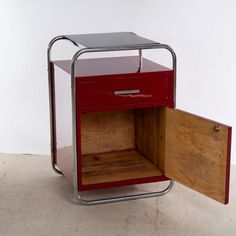 This Bauhaus side cabinet from the 1930s combines timeless elegance with functional sophistication. Manufactured in Germany, it impresses with its chrome-plated tubular steel frame, which gives it stability and a modern shine. The body and table top are painted in a striking black and crimson red, giving the piece of furniture a striking and stylish touch.  The cupboard is in excellent condition and is a real highlight for any living room or study. with clear lines and minimalist aesthetics, it Bauhaus Furniture Design, 1930s Furniture, Shabby Chic Storage, Bauhaus Furniture, Steel Cupboard, Narrow Storage Cabinet, Modern Storage Cabinet, Storage Cabinet Shelves, Chair Storage