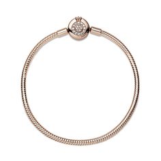 Bring some sparkle to every moment with the Pandora Moments Sparkling Crown O Snake Chain Bracelet. Hand-finished in 14K rose gold-plating, the bracelet's clasp features the iconic Pandora crown O monogram and bead-set clear cubic zirconia pavé, while the snake chain brings a chic and modern touch to your wrist. Stack it with other bracelets and load it up with favorite charms for a piece you'll reach for over and over. Luxury Rose Gold Diamond Bracelet With Sparkling Stones, Rose Gold Diamond Bracelet With Sparkling Stones, Luxury Rose Gold Bracelets With Sparkling Stones, Luxury Sparkling Rose Gold Jewelry, Rose Gold Charm Bracelet With Jubilee Bracelet, Rose Gold Charm Bracelet With Jubilee Detail, Rose Gold Jubilee Charm Bracelet, Elegant Rose Gold Charm Bracelet With Lobster Clasp, Rose Gold Round Bracelets With Charms