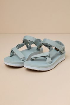 However you style the Teva Midform Universal Pearl Blue Sandals, they are sure to make any of your summer 'fits even more cute and comfortable! These sandals feature recycled REPREVEÂ® polyester yarn by UnifiÂ®, which shapes an adjustable VELCROÂ® toe strap that leads to a matching quarter strap. An on-trend, color block flatform foam sole completes the summer-ready look! Logo tag accents outstep strap. Available in whole sizes only. 1. 25" flatform sole. Lightly cushioned insole. Felted foam so Lightweight Sport Sandals For Summer, Nylon Sandals For Summer Vacation, Nylon Open Toe Sandals For Vacation, Open Toe Nylon Sandals For Vacation, Lightweight Nylon Sandals For The Beach, Spring Vacation Nylon Sandals, Nylon Open Toe Beach Sandals, Nylon Open Toe Sandals For Beach, Nylon Sport Sandals For Beach In Summer