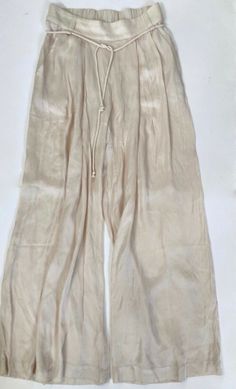 Pull on Wide Leg Back Elastic Waist Side Slash pockets Removable cord belt 55% Viscose 45% Rayon  Hand wash Spring Beach Parachute Pants With Pockets, Solid Wide Leg Beach Pants With Drawstring, Full-length Beige Bottoms For Beach, Beige Full-length Bottoms For The Beach, Beige Full-length Bottoms For Beach, Beige Full-length Beach Bottoms, Wide Leg Parachute Pants For Spring Beach Outings, Spring Beach Wide Leg Parachute Pants, Beige Parachute Pants With Drawstring For Summer