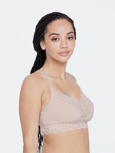 A busty bralette that was created for cups D-DDD. Made with 3-ply fabric cups and wider elastics and straps. Our Goddess lace can be found on the back detail and trims the neckline and bottom band, adding feminine details. Pair with a goddess panty to complete the look. Wireless bralette designed for D to DDD cups Goddess signature lace at neckline and bottom band 3-plys of ultra-soft fabric at cups for extra support Hidden elastic band anchors beneath the bust Over the head style with dramatic Ddd Cup, Head Style, Feminine Details, 40 Dress, Lingerie Collection, Lace Bra, Anchors, Bra Sizes, Elastic Band