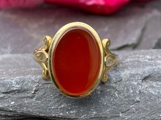 A very stylish and traditional signet ring in 9ct yellow gold set with a blank Carnelian stone Finger size M 1/2 or 6 3/4 US Full hallmarks for Birmingham 1994 In excellent condition Will arrive gift boxed Free tracked shipping/UK next day delivery. Classic Carnelian Signet Ring With Polished Finish, Classic Carnelian Signet Ring For Formal Occasions, Classic Carnelian Signet Ring For Formal Events, Classic Carnelian Signet Ring For Anniversary, Classic Round Carnelian Signet Ring, Classic Carnelian Round Signet Ring, Yellow Gold Carnelian Signet Ring Gift, Yellow Gold Carnelian Signet Ring As A Gift, Gift Carnelian Signet Ring In Yellow Gold