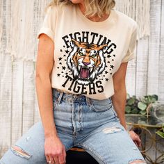 The Fighting Tigers t-shirt is perfect for all the sporting events. This retro and funky tiger tee is everything you've dreamed of and more. This adorable and soft shirt makes a great gift for tiger fans to wear to all the sporting events or just everyday wear! It feels soft and lightweight, with the right amount of stretch. It's comfortable and flattering for all.  Show off your personality with our fun and unique designs!   ** P R O D U C T   D E T A I L S **  - High Quality, Super Soft and Co Tiger Basketball, Tiger Tshirt, School Spirit Shirts Designs, Tigers Shirt, School Spirit Wear, Go Tigers, Tiger Football, School Spirit Shirts, Tiger Shirt