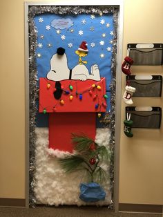 a door decorated to look like snoopy and charlie the dog is on top of a sleigh