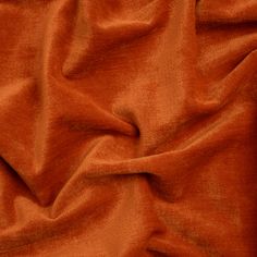 an orange fabric textured with velvet