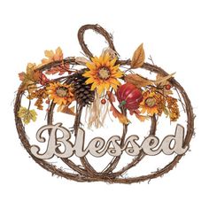 a pumpkin shaped sign with the word, blessed