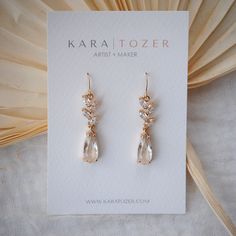 Effortlessly elegant, our floral CZ dangles are designed with marquis shaped CZ stones that descend into a teardrop shaped crystal. Whether you're a bride, wedding guest, or celebrating something special, these will give you a stunning look that will turn heads. Our most popular choice for brides and bridal parties. THE DETAILS -Earrings are finished with 14K gold filled hooks, cubic zirconia stones, and include soft rubber backings -Shipped via USPS with tracking *Please contact us via hello@ka Elegant Teardrop Chandelier Earrings In Cubic Zirconia, Elegant Cubic Zirconia Teardrop Chandelier Earrings, Cubic Zirconia Teardrop Chandelier Earrings, Wedding Cubic Zirconia Teardrop Earrings, Teardrop Cubic Zirconia Bridal Earrings, Elegant Teardrop Chandelier Earrings For Anniversary, Teardrop Chandelier Earrings With Sparkling Stones For Anniversary, Elegant Teardrop Crystal Bridal Earrings, Cubic Zirconia Teardrop Bridal Earrings