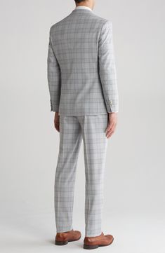 Sophisticated peaked lapels smarten the jacket of this trim-fit suit paired with flat-front trousers and finished in a handsome plaid print. 36 1/4" inseam; 7 3/4" leg opening; 10 1/2" rise (size 38R) Jacket has peaked lapels; chest welt pocket; front flap pockets Unhemmed Lined 70% polyester, 28% rayon, 2% spandex Dry clean Imported Fitted Sets With Welt Pockets For Business Casual, Fitted Business Casual Sets With Lapel Collar, Tailored Pantsuit With Lapel Collar For Semi-formal Occasions, Slim Fit Business Casual Sets With Notch Lapel, Fitted Pantsuit With Double Button Closure And Suit Collar, Semi-formal Pantsuit With Suit Collar, Office Sets With Slim Fit And Notch Lapel, Tailored Tuxedo Pantsuit With Suit Collar, Tailored Tuxedo Style Pantsuit For Office Wear