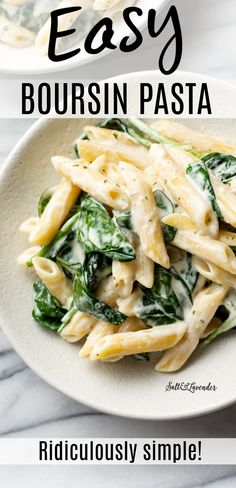 two plates with pasta and spinach on them