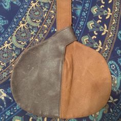 This Leather Bag Is About 11 1/2" Wide And About 9"' Tall. It Has A Unique Way Of Closing By Looping The Handle At The Top. Very Secure. Two Different Leather Colors, A Med/Dark Side And A Chocolate Colored Side. Nwot Brown Soft Leather Shoulder Clutch, Brown Crossbody Coin Purse For Everyday Use, Brown Crossbody Coin Purse For Daily Use, Brown Crossbody Coin Purse, Brown Leather Handle Clutch For Daily Use, Brown Handheld Clutch With Adjustable Strap, Brown Clutch With Leather Handles For Daily Use, Brown Soft Leather Clutch For On-the-go, Brown Soft Leather Satchel Clutch