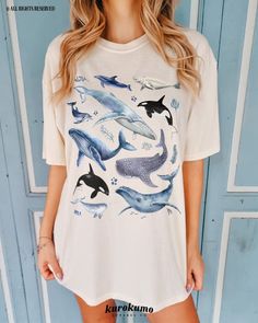 This Unisex garment-dyed t-shirt features a watercolor set of different whales, including a Narwhal, Humpbacks, and Orcas. It is the perfect gift for marine biologists, ocean conservationists, surfers and more! Make sure to check out the other garment options below :) » O P T I O N S « ‣ Hoodie: https://www.etsy.com/listing/1636311030 ‣ Crewneck: https://www.etsy.com/listing/1126253169 ‣ Youth Tee: https://www.etsy.com/listing/1518526240 » A B O U T « ‣ This item is made to order using direct-to Casual White Fish Print Top, Blue Casual Watercolor Print Top, Blue Casual Top With Watercolor Print, Casual Blue Watercolor Print Top, Casual White Tops With Watercolor Print, Casual White Top With Watercolor Print, Blue Short Sleeve Tops With Watercolor Print, Blue Short Sleeve Top With Watercolor Print, Casual Cotton Tops With Watercolor Print