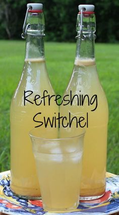 two bottles of refreshing switchel sitting on a table