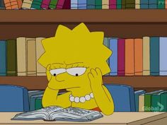 the simpsons is sitting in front of a bookshelf with many books on it