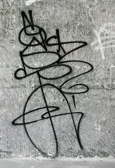 graffiti on the side of a concrete wall