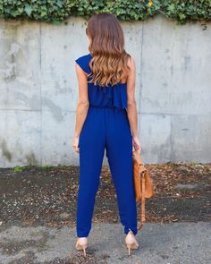 This simply chic jumpsuit is simply perfect. Featuring a realized fit with a one shoulder exposed and a ruffled top that extends from font to back, a cinched waist with a sash belt and tapered legs. This jumpsuit pairs perfectly with wedges, heels or sandals. Made with a blend of cotton and polyester and comes in four fabulous colors from which to choose. Fitted One-shoulder Jumpsuit With Ruffles, Fitted One-shoulder Ruffled Jumpsuit, One-shoulder Fitted Jumpsuit With Ruffles, Spring One Shoulder Ruffled Jumpsuits And Rompers, Fitted Blue Off-shoulder Jumpsuits And Rompers, Spring One-shoulder Ruffled Jumpsuits And Rompers, One-shoulder Ruffled Jumpsuits And Rompers For Spring, Blue Fitted Off-shoulder Jumpsuits And Rompers, One Shoulder Solid Jumpsuits And Rompers For Spring