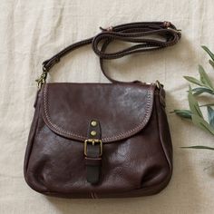 Street Fashion Cowhide Leather Saddle Bag in Dark Coffee Black - Morimiss.com Cheap Vintage Natural Color Shoulder Bag, Cheap Light Brown Crossbody Bag, Brown Saddle Bag For Daily Use In Fall, Everyday Brown Saddle Bag With Phone Pocket, Brown Crossbody Saddle Bag With Cell Phone Pocket, Brown Satchel With Pockets For Fall, Brown Fall Satchel With Pockets, Brown Shoulder Bag With Cell Phone Pocket For Fall, Brown Saddle Bag With Removable Pouch For Fall