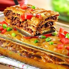 a casserole dish filled with meat and vegetables