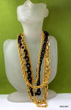 "This stunning heavy five layered strands : black resin and five different chains necklace. Each chain of necklace is individually articulated for maximum drape and fluidity. One of the chains has been made of resin. The necklace is 20\" long. The necklace has a toggle clasp. Condition is excellent with no obvious damage or wear. This is a gorgeous vintage piece of 1980's. Mark on tag reads \"Kenneth Lane\". So interesting and elegant piece of jewelry. It is a vintage item in good condition. Ple Black Double Chain Link Necklace, Black Double Chain Necklace For Party, Black Multi-strand Chain Jewelry, Black Multi-strand Adjustable Chain Necklace, Black Multi-strand Chain Necklace With Adjustable Chain, Black Multi-strand Chain Necklace, Haute Couture Jewelry, Vintage Haute Couture, Couture Necklace