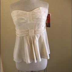 Gorgeous With Tags, Nanette Lepore Dressy Cream Strapless Blouse, With Back Strap To Keep It Sitting On Your Bust. It Says A Size 12. The Front Is Pleated At The Bust With A Built In Waist Belt And A Loose Front Panel. The Back Zoos Up. Bust 36” Waist 30” Length 19”. It Is Lined And In Mint Condition. Sexy, Classy And Pretty. It’s Silk And Polyester Party Camisole With Sweetheart Neckline And Built-in Bra, Strapless Camisole With Built-in Bra For Party, Elegant Summer Tube Top With Built-in Bra, Feminine Fitted Tube Top With Built-in Bra, Chic Evening Corset With Spaghetti Straps, Elegant Spaghetti Straps Bodice With Boned Bodice, Flirty Sleeveless Corset With Built-in Bra, Glamorous Strapless Tube Top With Built-in Bra, Strapless Flirty Corset With Built-in Bra