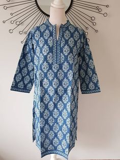 Jaipur Cotton Indian Hand Block Printed Indigo Kurta will certainly catch you admiring glances in the sun.  Crafted with care in Jaipur, India, this tunic is a testament to fine craftsmanship. Hand block printed on soft cotton voile, it seamlessly blends style and comfort, making it the ideal choice for your poolside lounging, a fashionable beach cover-up, or even as your daily wear, paired effortlessly with leggings or Capri pants. The fabric is a testament to its quality, being super lightweig Blue Bohemian Kurta For Transitional Season, Spring Ikat Print Straight Kurta, Traditional Indigo Kurta With Block Print, Spring Straight Kurta With Ikat Print, Summer Long Sleeve Kurta With Motifs, Festive Tunic Kurta For Vacation, Casual Indigo Kurta For Summer, Traditional Kurta For Beach Festivals, Bohemian Spring Kurta With Motifs