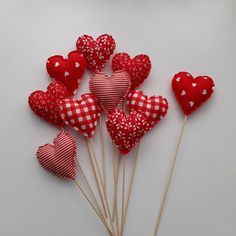 red and white heart shaped lollipops on sticks