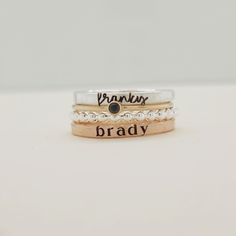 Show off your name and birthstone in style with this stunning Stacking Name Ring Set! Includes 4 stackable rings: a sterling silver beaded ring, a fine silver name ring, a 14K gold-filled birthstone ring, and a 14K gold-filled name ring Perfect personalized gift for mom, wife, daughter, sister or friend Name ring beautifully displays any name or date in elegant lowercase script and modern typewriter font Choose your personalized birthstone to represent your birthday month This one-of-a-kind ring Adjustable 14k Gold Hand Stamped Rings, Adjustable Stackable Rings With Custom Name, Adjustable 14k Gold Hand-stamped Rings, Everyday Adjustable Stackable Engraved Ring, Adjustable Personalized Stackable Rings, Personalized Rose Gold Stackable Rings With Round Band, Adjustable Engraved Stackable Ring For Everyday, Personalized Rose Gold Stackable Rings, Custom Name Adjustable Stackable Rings