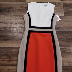 Beautiful Calvin Kline Colorblock Pencil Dress In Size 6 - New With Tags! The Dress Has The Colors: Cream, Tan, Black, And Redish Coral Like Color. The Inside Label Is Loose On One Side (See Pics) But Does Not Affect The Dress In Any Way. Measures 38in From Shoulder To Hem. Smoke-Free Home. ***Offers Welcome*** Fitted White Color Block Dress, Multicolor Color Block Dresses For Workwear, Fitted Color Block Work Dresses, Color Block Fitted Dress For Work, Fitted Color Block Dress For Work, Multicolor Sheath Dress For Work, Calvin Klein Dresses, Pencil Dress, Womens Calvin Klein