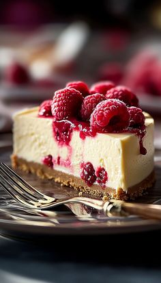 a piece of cheesecake with raspberries on top