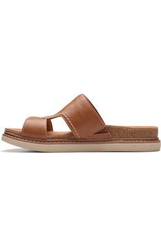 Casual Slide Footbed Sandals With Ortholite Insole, Comfortable Brown Slides With Arch Support, Casual Leather Footbed Slide Sandals, Comfortable Textured Footbed Slip-on Slides, Comfortable Slip-on Sport Sandals With Leather Footbed, Comfortable Slides With Cushioned Footbed, Classic Cushioned Slides, Classic Beach Slides With Cushioned Footbed, Classic Cushioned Slides For Beach