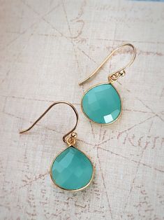 Lightweight and charming, these delicate green Chalcedony Earrings feature faceted pear-shaped drops in softly translucent deep aqua hues. The gemstones are set in 18k gold over sterling silver (Vermeil.) Very pretty and perfect for work or to wear with your hair up. Drops measure 1/2 inch. Handmade in IndiaDesigned in New York © All artwork, jewelry designs, and digital images are the property of Summer Indigo and may not be copied or reproduced without permission. Turquoise Teardrop Faceted Earrings, Turquoise Faceted Teardrop Earrings, Faceted Turquoise Teardrop Earrings, Elegant Turquoise Drop Teardrop Earrings, Pear-shaped Gemstone Teardrop Earrings For Gift, Pear-shaped Teardrop Gemstone Earrings As Gift, Pear-shaped Teardrop Gemstone Earrings For Gifts, Elegant Turquoise Teardrop Earrings As Gift, Pear Shaped Teardrop Gemstone Earrings For Gifts