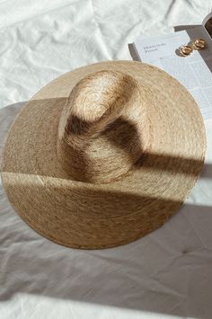 Lack of color Palma Wide Fedora is handmade by artisans in Mexico, our new 100% baked palm leaf hats are perfect for the Summer soiree of your choice. Featuring a cowboy crown and tightly woven pressed palm, this hat is made for Summer. Natural Palm Leaf wide-brimmed western hat 100% Palm Leaf in Natural Inner elastic sweatband to help with fitBrim measures approx. 12 cm / 4.7” Sits higher on head Spot / specialist clean This hat is accredited with a UPF Rating 50+ (Australian Tested) Please note, hat features including straw color and brim width may vary slightly from piece to piece. These hats are individually handcrafted by artisans, each with its own unique character. We want your new hat to be as unique as the person wearing it and consider this a contribution to the unique character Artisan Flat Brim Toquilla Straw Hat, Handmade Toquilla Straw Panama Hat With Curved Brim, Handmade Wide Brim Panama Hat In Toquilla Straw, Handmade Toquilla Straw Panama Hat With Wide Brim, Handmade Wide Brim Fedora In Toquilla Straw, Handmade Wide Brim Toquilla Straw Fedora, Handwoven Natural Straw Hat For Rodeo, Natural Handwoven Straw Hat For Rodeo, Handmade Brimmed Boater Hat In Toquilla Straw