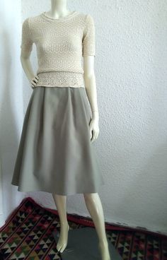 70s retro skirt, C&A elegant spring skirt, A-shape, minimalist skirt, high waist simple neutral skirt, grey-sage green skirt, 48 size, basic skirt, polyester jersey fabric, lining is poliamid. C&A brand, made in West Germany. Measurements laying flat : waist:43 cm (17inches) hips :free total lenght:72 cm (28,5 inches) Neutral Skirt, Minimalist Skirt, Spring Skirt, Retro Skirt, Basic Skirt, Skirt High Waist, Spring Skirts, 70s Retro, West Germany