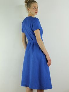 "Spring dress, Write the selected color in the message Handmade blue bayou wrap dress with short sleeves, 2 pockets and belt , perfect for casual wear and suitable for any occasion in any season Details: - 100% natural linen produced in Europe ; - medium weight (180 gram per square meter); - color: blue bayou , could be any from our colors catalog (color samples at the photo); Made to order, approximately a few days, If you have any questions please message me and I will be glad to answer. Size Fitted Belted Short Sleeve Wrap Dress, Fitted Belted Wrap Dress With Short Sleeves, Blue Short Sleeve Belted Midi Dress, Blue Belted Midi Dress With Short Sleeves, Short Sleeve Linen Dress For Beach, Linen Dress With Tie Waist And Short Sleeves, Fitted Short Sleeve Linen Dress For Work, Fitted Linen Dress With Short Sleeves For Work, Fitted Blue Linen Dress