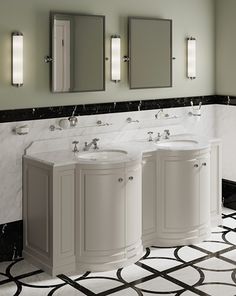 a bathroom with three sinks and mirrors in it