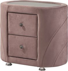 a pink velvet night stand with two drawers