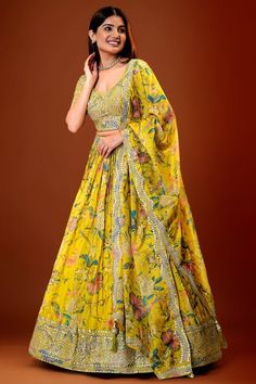 Beautiful Georgette floral print Croptop lehanga with sequin embellishments size XXL 44 ready to ship. Make a radiant statement at your Haldi ceremony with our exquisite Yellow Floral print Georgette Lehenga Set! Crafted with meticulous embroidery work, this ensemble exudes elegance and charm. The vibrant yellow hue adds a pop of color, perfect for celebrating the joyous occasion. Fabric Details: Top: Georgette Bottom: Georgette Dupatta: Organza Color Details: Top: Yellow Bottom: Yellow Dupatta: Bollywood Semi-stitched Sets With Floral Print, Bollywood Designer Floral Print Sets, Elegant Floral Print Choli For Diwali, Bollywood Style Floor-length Floral Print Set, Bollywood Style Floral Print Sharara For Festive Occasions, Elegant Floral Print Choli For Festive Occasions, Elegant Festive Floral Print Choli, Floral Print Georgette Choli With Traditional Drape, Georgette Choli With Floral Print And Traditional Drape